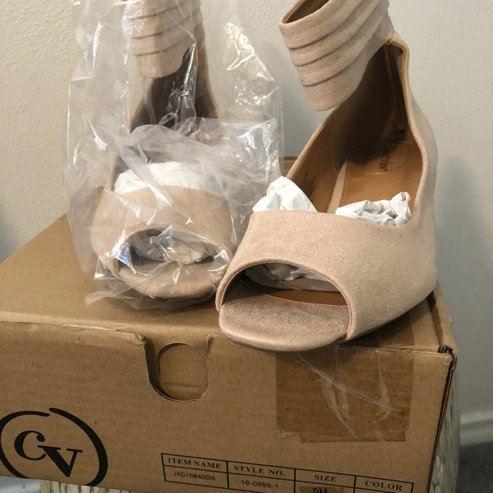 Light tan ankle-strapped peep-toe flat sandals